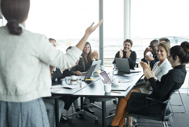 photo of woman leading a business meeting.