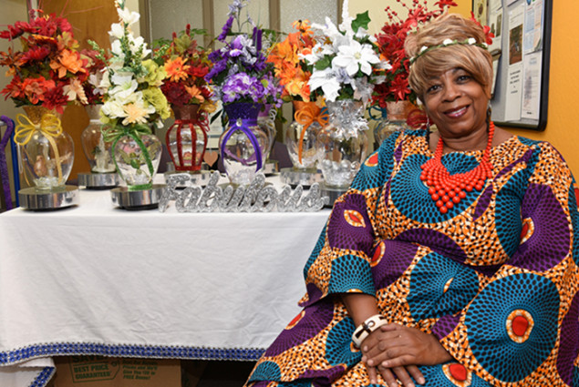 Photo of woman entrepreneur with her decorative art products