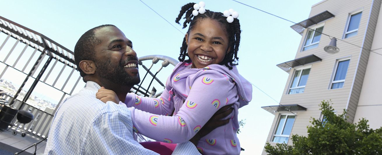 photo of Micah and daughter at 1101 Connecticut