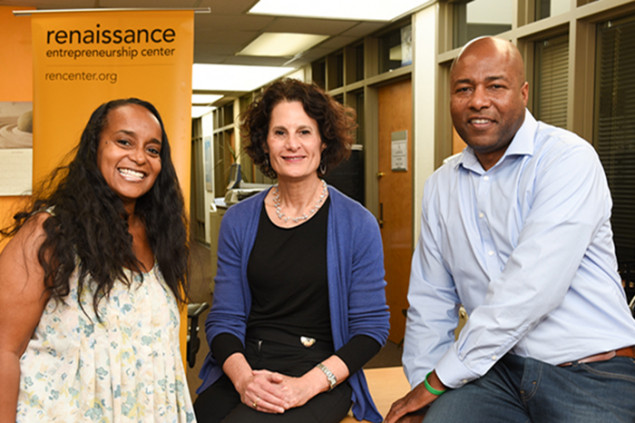 Ericka Scott and Marcus Tartt with Renaissance CEO Sharon Miller (center).