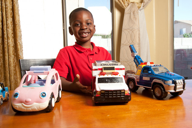 Kindergartner Muhoza enjoys math and science, especially looking at dinosaur bones.