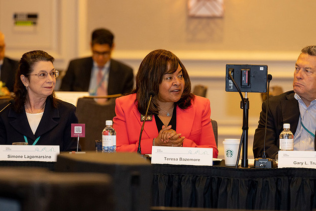 photo of FHLBank President and CEO Teresa Bryce Bazemore (center) with Bank board members Simone Lagomarsino and Gary Trujillo and the Bank's Homeownership Solutions Summit in Phoenix.