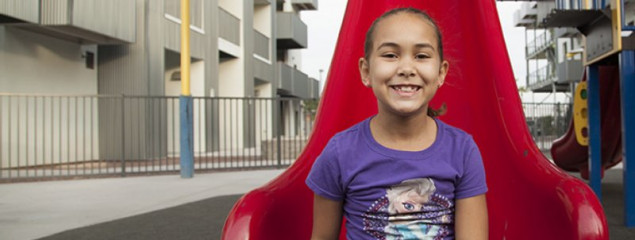 photo of child on a slide